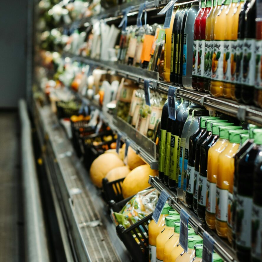 Chiller cabinet in supermarket packed with drinks