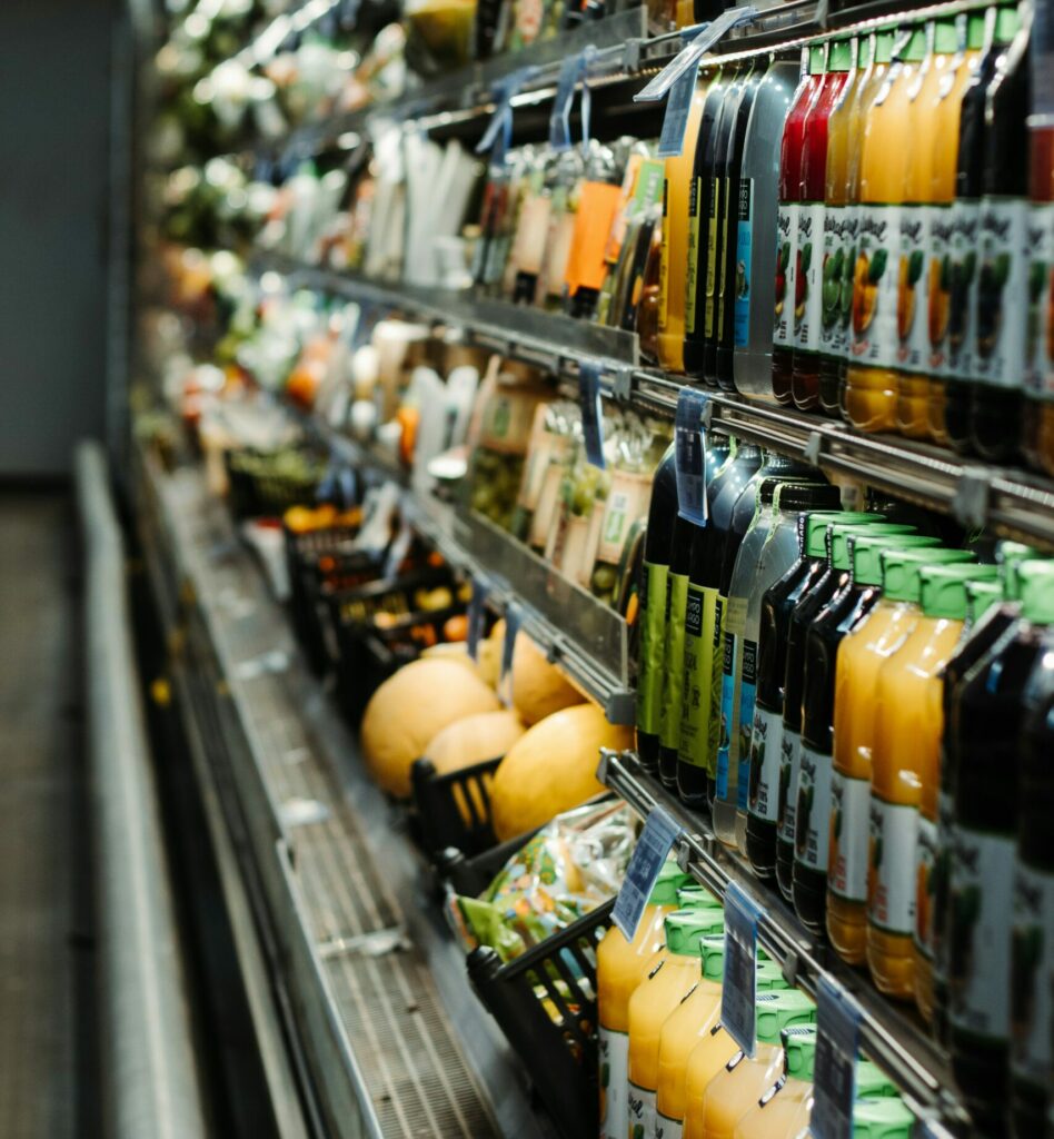 Chiller cabinet in supermarket packed with drinks